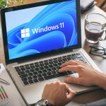 Man using Windows 11 laptop