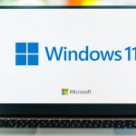 Laptop with Windows 11 and Microsoft logos